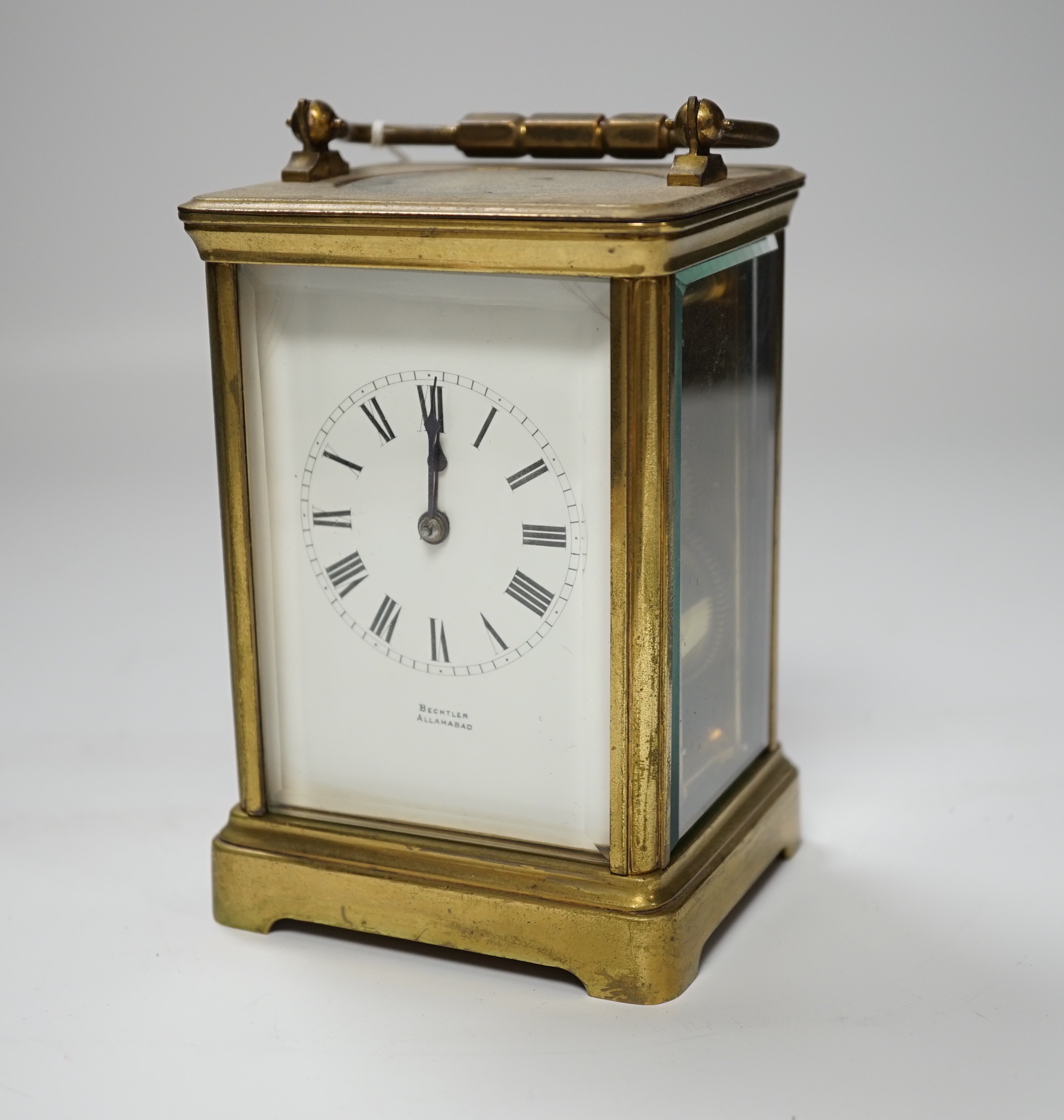 A brass carriage clock, dial signed Bechtler Allahabad, striking on a coiled gong, 13.5cm high